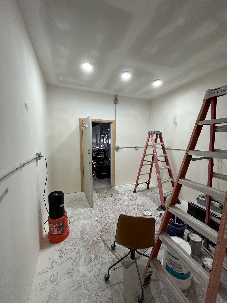 Panagraph Studios build — the bare shell, drywall taped and primed