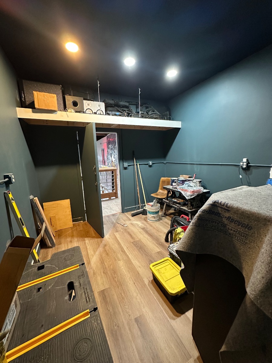 Panagraph Studios build — painted walls, new flooring and the storage loft above the door