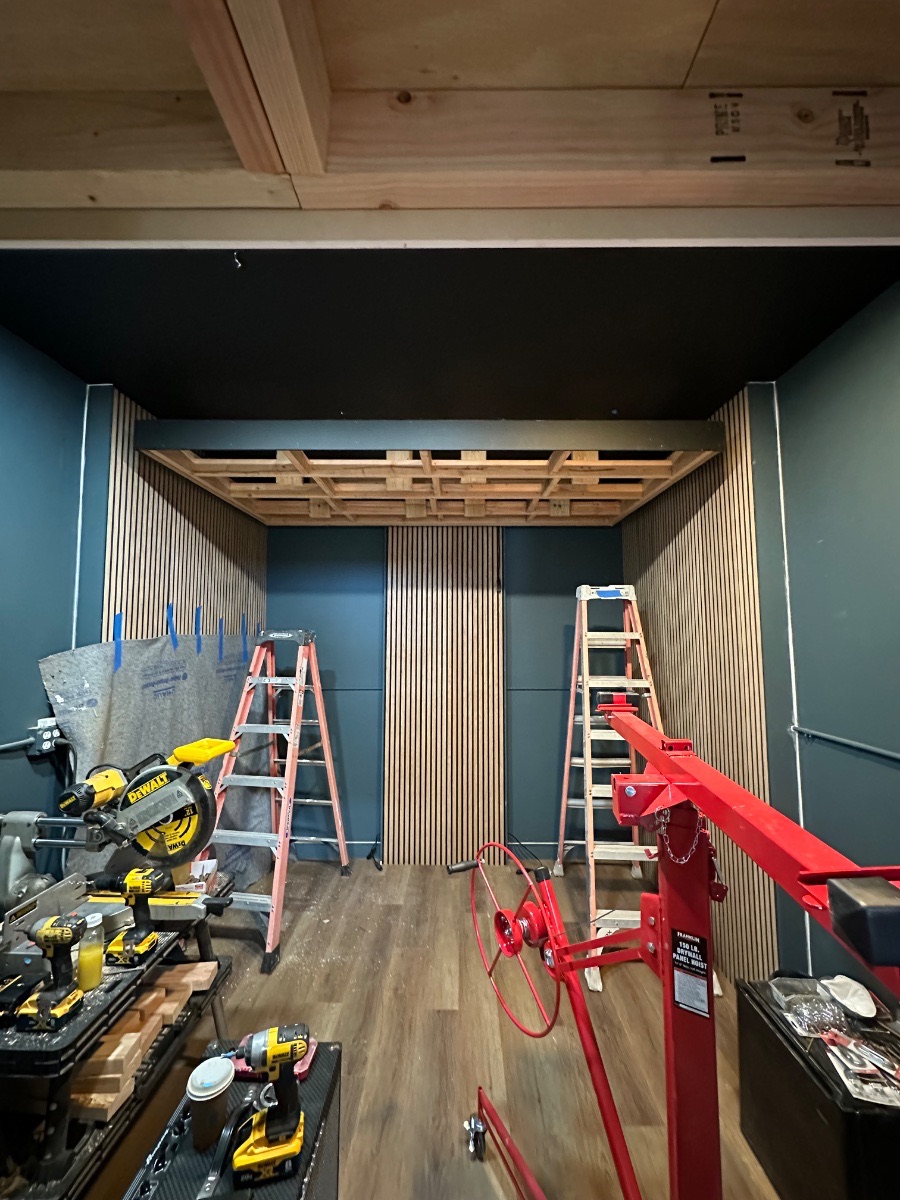 Panagraph Studios build — the ceiling coffer framed and set, with the slat walls finished around it