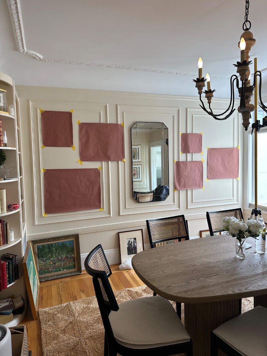 Pacific Heights — full-size pink paper templates taped to a panelled dining room wall to set the composition before hanging, San Francisco