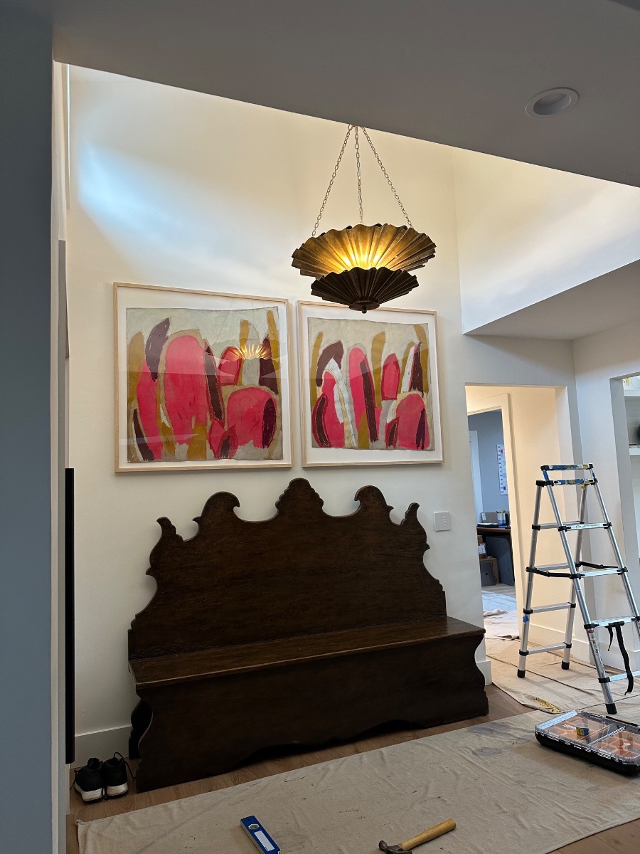 Fine art installation by Aero Luxe &mdash; A matched pair hung above an antique bench, Mill Valley, California