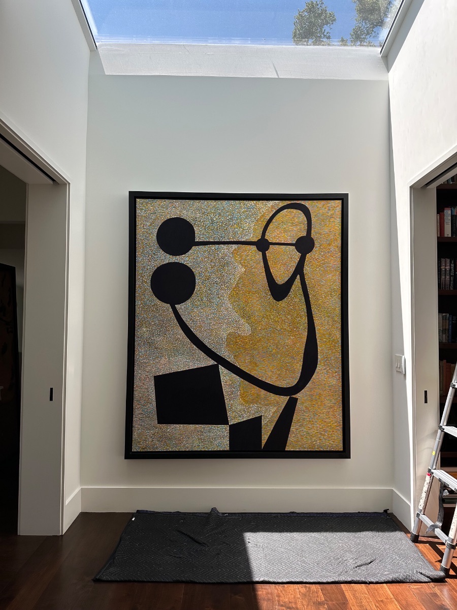 Fine art installation by Aero Luxe &mdash; A large black and gold abstract lit by a slot skylight, Bel Air, California