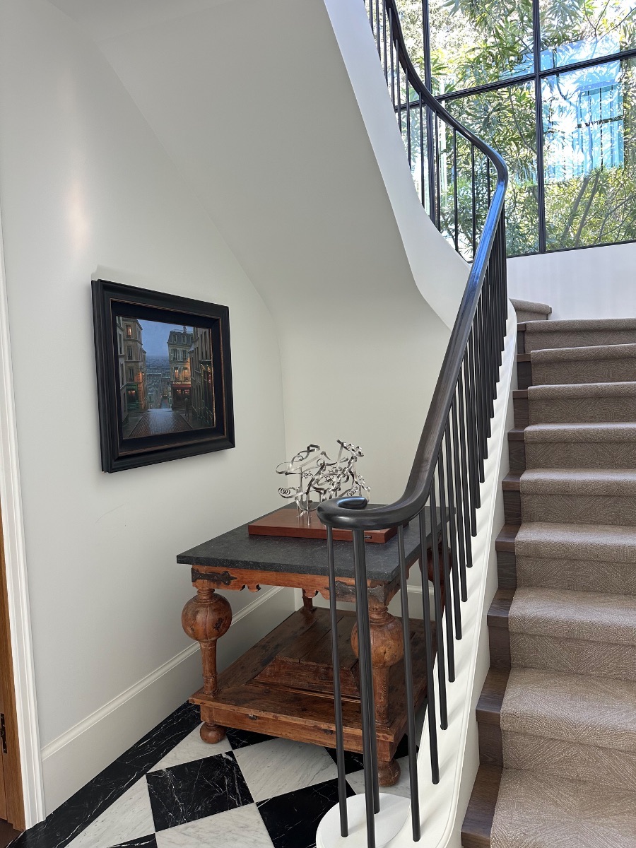 Fine art installation by Aero Luxe &mdash; A small painting placed at the turn of the stair, Sea Cliff, California