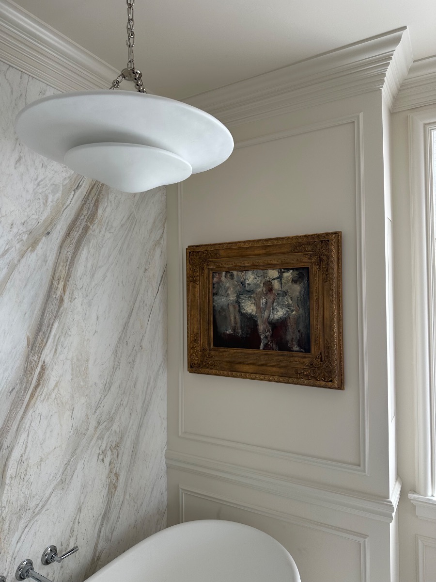 Fine art installation by Aero Luxe &mdash; A gilt-framed painting hung on panelled walls, Montecito, California