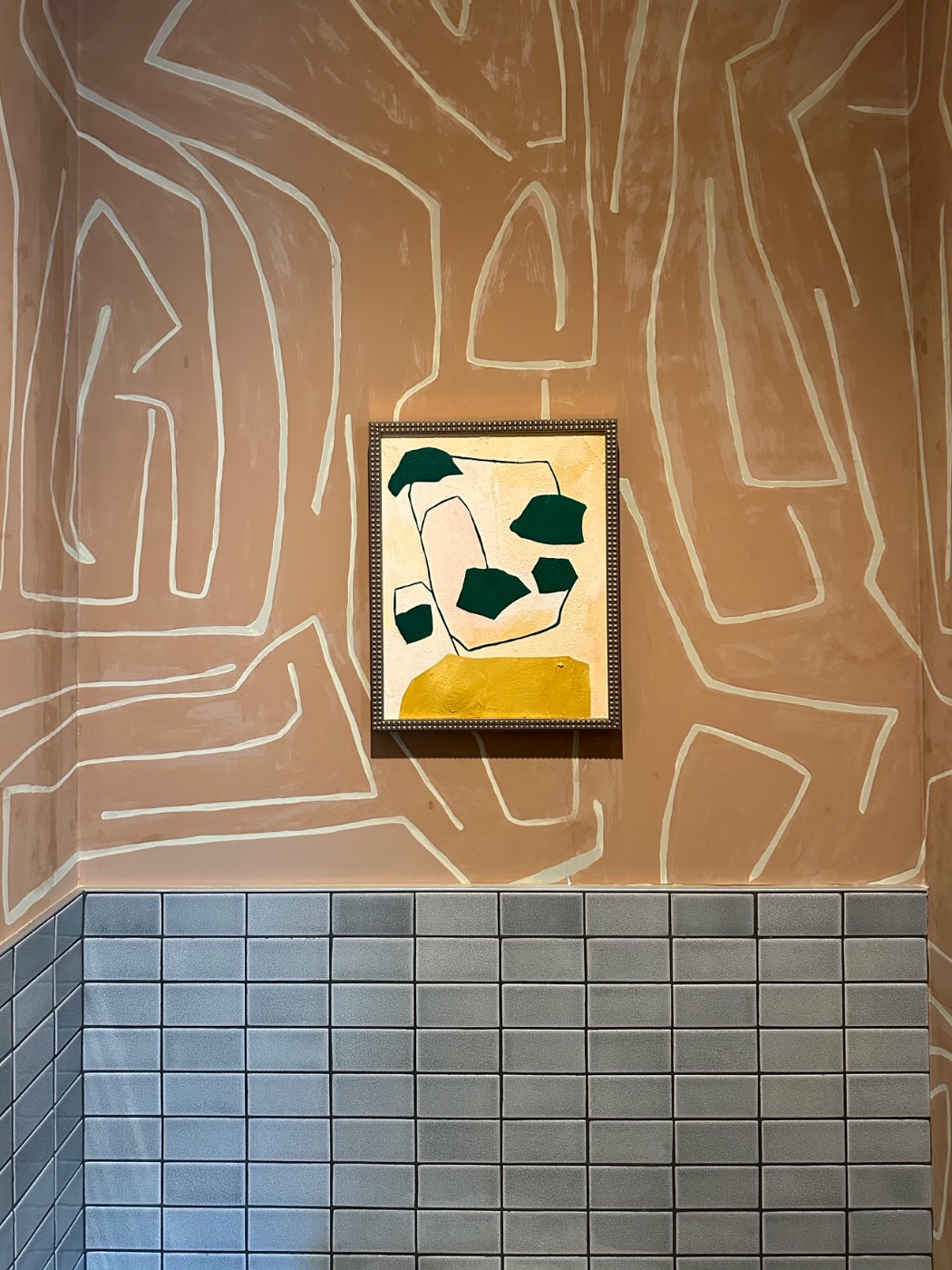 A framed work placed on lime plaster in a Santa Barbara residence, California